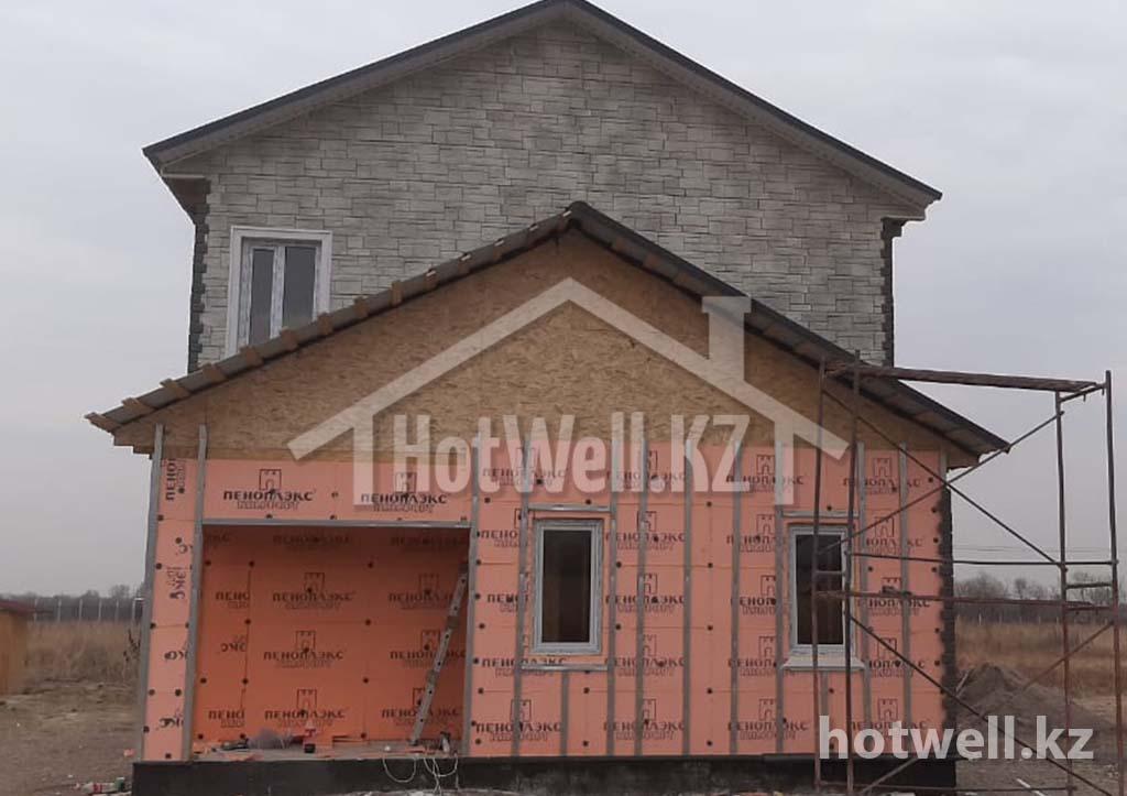 Дом на этапе отделки фасада — строительство HotWell.kz